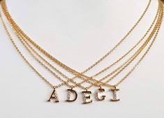 Gold Plated Tiny Pave Initial Letter Necklace, Personalized Pendant, Dainty, Bridesmaid, Wedding Minimalist Bridal Party Gift, Upper Case This beautiful minimalist necklace features a gold plated initial, encrusted with CZ crystals. Dangling from a delicate cable link chain, it's just the piece to bring an extra-special touch to your favorite outfits. It makes a heartfelt gift for your bff, your bridesmaids, or any special person in your life. Details: Materials: gold plated brass and Cubic Zirc Elegant Name Necklace For Bridesmaid Gift, Elegant Name Necklace For Bridesmaids, Elegant Adjustable Name Necklace With Delicate Chain, Elegant Name Necklace With Delicate Adjustable Chain, Elegant Custom Name Initial Necklace, Elegant Silver Initial Necklace For Bridesmaid Gift, Minimalist Wedding Initial Necklace With Delicate Chain, Elegant Name Necklace For Bridesmaid Gift On Mother's Day, Elegant Custom Name Jewelry For Bridesmaid Gift