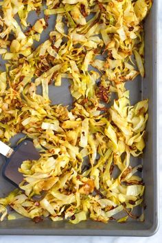 a pan filled with chopped up vegetables on top of a table