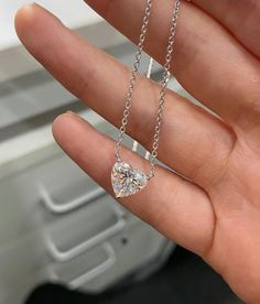 THE NECKLACE DISPLAYED IN THE PICTURES FEATURES A 3 CARAT LAB GROWN DIAMOND A heart-shaped diamond (or moissanite) necklace, featuring a minimalist design, epitomizes elegance through its simplicity. The diamond (or moissanite) delicately set without bezel takes center stage without distraction. The chains are available in different length ranging from 14 inches to 18 inches, available in 14K, 18K gold karats or sterling silver, and is available white, yellow, or rose color. You may also choose Luxury Heart Cut Brilliant Solitaire Necklace, Heart Shaped Diamond Necklace, Carat Sizes, Casual Necklaces, Heart Necklace Diamond, Moissanite Necklace, Heart Shaped Necklace, Diamond Necklaces, Necklace Display