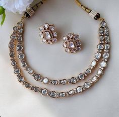 This Rose Gold Plated opulent necklace set is fit for a bride and even her close ones attending the wedding. This necklace is a perfect amalgam of timeless style and drama that draws in attention. Necklace Closure - Adjustable Dori Earrings Closure - Push Back Style Tip - When it comes to getting a classic look, nothing can be better than kundan. This necklace set is fit for a woman who is fiercely independent yet rooted in traditional and cultural heritage, carving her own style with classic an Simple Kundan Jewellery, Kundan Jewellery Set Necklaces, Kundan Jewellery Set Simple, Kundan Necklace Simple, Rose Gold Necklace Set, Polki Diamond Necklace, Fiercely Independent, Uncut Diamond Necklace, Sabyasachi Jewelry