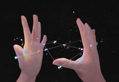 two hands reaching up towards each other with dots in the sky and stars above them