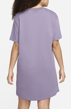 Take your athleisure game to the next level with a soft cotton jersey dress that feels like your favorite Nike T-shirt in a comfortably oversized fit. 34 1/2" length (size Medium) Crewneck Short sleeves Unlined 100% cotton Machine wash, tumble dry Imported Casual Solid Color T-shirt Dress For Loungewear, Oversized Casual T-shirt For Daywear, Casual Cotton T-shirt Dress With Relaxed Fit, Relaxed Fit Cotton T-shirt For Day, Cotton T-shirt Dress With Graphic Print, Relaxed Fit, Cotton Relaxed Fit T-shirt For Daywear, Cotton T-shirt Dress For Everyday, Nike Sporty Loungewear T-shirt, Oversized Graphic Print T-shirt Dress With Crew Neck