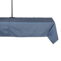 a blue table cloth with an umbrella on it