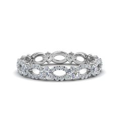 a white gold band with round cut diamonds in the center and two rows on each side