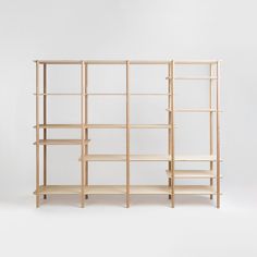 a wooden shelf with three shelves on each side, and two smaller shelves behind it