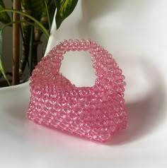 🌸 Elegant and Stylish: The handmade pink bead bag is the perfect choice to add elegance and style to any occasion. With its shimmering bead details, this bag complements every style and elevates every outfit. 👜 Functionality Meets Elegance: This bag offers both elegance and practicality. Crafted with intricate details, this design can be used for everyday wear as well as for special occasions, making it a versatile accessory. 🌸Size: 25cm x 20 cm.  This bag is spacious enough to hold your phon Pink Beaded Tote Bag, Pink Rectangular Shoulder Bag With Pearl Handle, Pink Beaded Bag For Everyday Use, Everyday Pink Beaded Bag, Pink Beaded Pouch Bag, Pink Beaded Shoulder Bag For Party, Pink Beaded Party Shoulder Bag, Hand Beaded Bag, Bead Bag