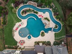 an aerial view of a swimming pool and surrounding buildings