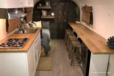 a small kitchen and living area in a tiny home