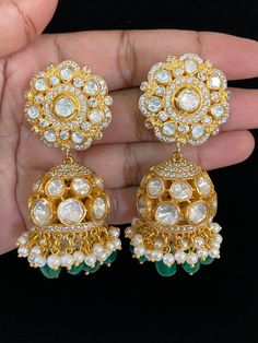 These earrings would have a luxurious, traditional jhumki design, combining modern moissanite brilliance with Kundan beauty. Goddess Dress, Kundan Earrings, Cz Earrings, Finger Rings, Antique Earrings, American Diamond, Pendant Set, Designer Earrings, Anklets