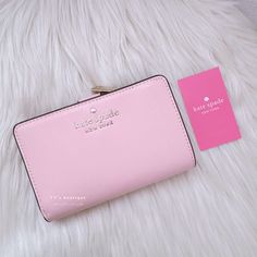 Color: Chalk Pink Material: Saffiano Leather Condition: Brand New With Tag Style Number: Wlr00128 Dimension: 4.5" H X 5.5" W X 1" D Ksny Metal Pinmount Logo Two Way Spade Jaquard Lining Interior: 8 Credit Card Slots, Id Window, 4 Slip Pockets, 2 Bill Folds Exterior: L-Zip Coin Compartment Snap Closure Dust Bag Not Included This Medium Wallet Holds All Your Credit Cards, Bills, Loose Change, I.D., Receipts, Ticketsand It Won't Take Up All The Space In Your Bag. 100% Authentic Comes From Clean Sto Formal Kate Spade Clutch, Chic Pink Bifold Wallet, Kate Spade Pink Bifold Wallet, Chic Kate Spade Bifold Wallet, Kate Spade Pink Leather Wallet, Formal Pink Kate Spade Wallets, Kate Spade Staci, Dream Bag, Loose Change