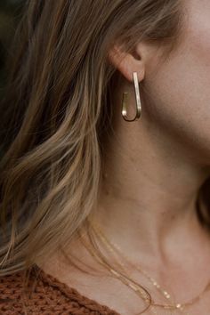 "Meet the Anais hoops, a sweet and subtle earring in a unique geometric shape. Lightweight and ever so versatile. These earrings can be personalized to your preferred metal in either 14 karat gold-fill or sterling silver.  2\" in length Hypoallergenic  All metals are 14k gold-fill or sterling silver and with care will last a lifetime. Gold-fill contains 100x more gold than plated gold metal. Gold-fill and sterling will not chip or flake and when worn regularly, will keep their shine. They are hypoallergenic and will not discolor the skin." Elegant Geometric Everyday Earrings, Modern Linear Earrings For Everyday Wear, Everyday Single Geometric Earring, Everyday Geometric Single Earring, Modern Drop Wrap Earrings For Everyday, Modern Everyday Drop Linear Earrings, Modern Wrap Drop Earrings For Everyday, Minimalist Geometric Earrings As Gift, Modern Everyday Linear Earrings With Ear Wire