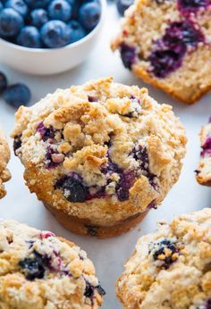 blueberry muffins with fresh blueberries in the background