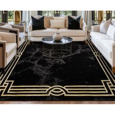 a living room with couches, chairs and a rug in black and white colors