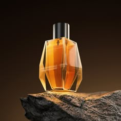 an orange bottle sitting on top of a rock next to a brown wall and black background