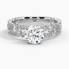 a white gold engagement ring with diamonds on it