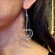 These unique, stylish and eye-catching long sterling silver earrings will always be the center of attention. These geometric silver earrings with semi circles and a bar are hammered, textured, and polished entirely by hand in our studio. The diameter of their semi circle is approximately 3 cm. and total lenght of them is approximately 7.50 cm. Every piece in our studio is hand crafted, which makes each one unique. You will have a very similar-looking earrings, but no two pieces are exactly identical. Each order comes beautifully packaged and gift wrapped. If you have any additional questions about these earrings, please feel free to contact us directly. We will get back to you within a few hours.  100% handmade! We hope you enjoy our designs as much as we enjoy creating them ❤  Want to fin Modern Sterling Silver Nickel-free Linear Earrings, Modern Pierced Dangle Linear Earrings, Modern Dangle Linear Earrings, Modern Nickel-free Sterling Silver Linear Earrings, Modern Silver Hypoallergenic Linear Earrings, Modern Nickel-free Dangle Linear Earrings, Modern Hypoallergenic Silver Linear Earrings, Modern Sterling Silver Linear Earrings With Ear Wire, Modern Silver Linear Earrings As Gift