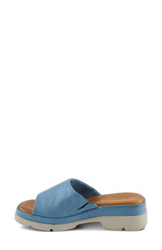 A subtle platform and chunky heel elevate a leather slide sandal fitted with a gore inset on cushioned footbed for optimal comfort. 2" heel; 1" platform Elastic gore inset Memory foam cushioning Leather upper and lining/synthetic sole Made in Turkey Modern Blue Slip-on Sandals, Leather Wedge Heel Slides With Textured Footbed, Leather Slides With Textured Footbed And Wedge Heel, Blue Slip-on Modern Sandals, Blue Modern Slip-on Sandals, Leather Slides With Arch Support And Wedge Heel, Modern Blue Slip-on Mules, Casual Leather Platform Slippers With Arch Support, Modern Blue Leather Sandals