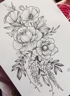 a black and white drawing of flowers on paper