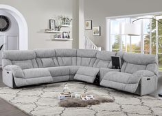 a living room with a large gray sectional couch