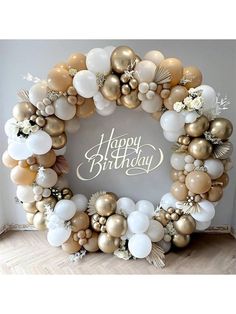 a happy birthday balloon wreath with gold and white balloons