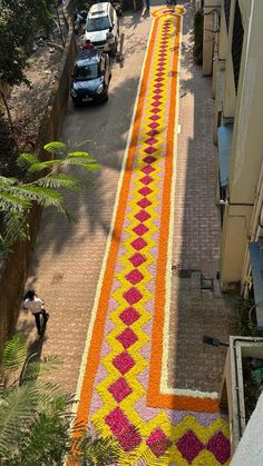 an aerial view of a street decorated with flowers