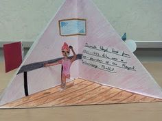 an origami model of a woman holding a large piece of paper with writing on it