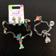 New With Tags, Unworn. Princess Jasmine Necklace And Stud Earring Set. Gold With Blue Gems. Silver Disneyland Charm Bracelet With Jessie Charm, Pixar Fest Charm, Castle And Disneyland Resort Charm. Perfect For A Disney Lover. All Pieces Sold Together As A Set. Themed Jewelry For Disney Fan Events, Minnie Mouse Outline, Fairy Heart, Mickey Mouse Christmas, Flower Charm Necklace, Bff Necklaces, Disney Designs, Disney Trading Pins, Princess Jasmine