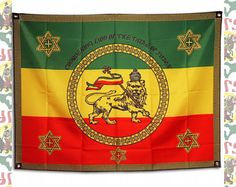 a flag with an image of a lion on it's side and other symbols around it