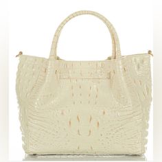 Brahmin Small Mallory Satchel Purse. Signature Croc-Embossed Leather In An Elevated Off-White Shade With Shimmery Gold Tipping. Genuine Leather. Tab Closure Center Divider Pocket Removable Adjustable Crossbody Strap Footed Bottom Back Slide-In Pocket Interior Zip Pocket Organizer Pocket Pen Pocket Key Clip 5" Handle Drop 20" Strap Drop White Everyday Luxury Bag With Handles, White Luxury Everyday Bags With Handles, White Luxury Everyday Bag With Handles, White Everyday Luxury Bags With Handles, White Shoulder Bag With Detachable Handle For Everyday Luxury, Luxury White Bags With Handle Drop, Classic White Luxury Shoulder Bag, Classic White Bag For Everyday Luxury, Luxury White Shoulder Bag With Handles