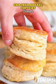 a stack of crocker barrel biscuits on a plate with text overlay that reads cracker barrel copycat biscuits