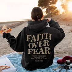 "Cozy Haven: Your Destination for Faith Over Fear Hoodies!" When wearing this sweatshirt, Encounter difficulties will not escape, but embrace courage. A Unique Conversation Starter✨ Comfortable Stylish Feel Look Amazing Spread Positivity! Believe and Be BlessedAs you wear these hoodies, may you inspire others to believe in the endlesspossibilities that come with unwavering faith. Let your attire reflect yourdevotion and share the boundless love of God with the world. Daily reminder to be guided byfaith, not by fearWhenever you're feeling in the dumps and life gets tough, look at yourhoodie and remember that God will get you through everything. Such abeautiful way to always remember to give God the glory. "Embrace Courage with Our Faith Over Fear Hoodie!Stay cozy and inspired with our premi Bold Faith, Faith > Fear, Buy Hoodies, Winter Hoodies, Fear Of The Lord, Faith Over Fear, Outfit Casual, Casual Outfit, Winter Sale