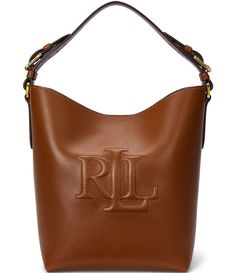 From Lauren Ralph Lauren&#x2C; the Medium Witley Leather Bucket Bag features:Leather shellCotton liningMagnetic snapped closureOversize “LRL” bombé logo at the flap“Lauren Ralph Lauren est. 1967”–engraved metal plaque on the interiorZip pocket and a slip pocket at the interiorTop handle with approx. 7.5" drop lengthRemovable&#x2C; adjustable crossbody strap with a 21" maximum dropApprox. 10" H x 11.5&quot Designer Ralph Lauren, Ralph Lauren Leather, Leather Bucket Bag, Leather Bucket, Metal Plaque, Short En Jean, Women Accessories Bags, Medium Bags, Crossbody Strap