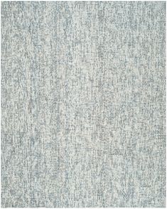 a blue and white rug with small squares on it