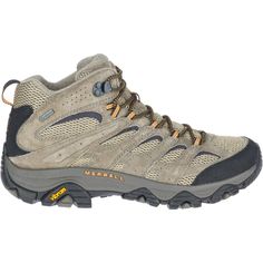 a man's hiking shoe is shown in grey and brown colors with yellow laces