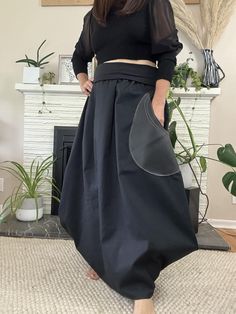 A must-have addition to your wardrobe! This skirt, with its unique geometrical pattern and bubble shape, it will add a stylish and modern flair to any outfit. The waistband is made with a soft, stretchy material that moves with you, never feeling restrictive.  And a leather pocket on the side adds a luxe touch while also giving you a handy place to stash your essentials. Whether you dress it up with a blazer and heels or keep it casual with a t-shirt and sneakers, this skirt is so versatile. Modern Full Skirt Fitted, Modern Fitted Full Skirt, Modern Stretch Pencil Skirt, Modern Lined Skirt, Modern Lined Pencil Skirt, Modern Fitted Maxi Skirt, Fitted Modern Maxi Skirt With Lined Skirt, Modern Fitted Lined Maxi Skirt, Fitted Modern Lined Maxi Skirt