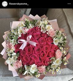 a large bouquet of red and pink roses