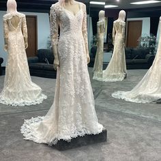 mannequins dressed in wedding gowns on display