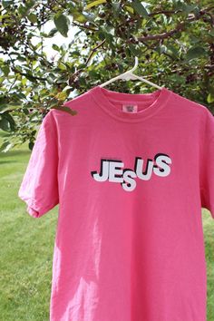 Hi! Welcome to KaleaCustoms! This shop spreads Gods love with positive christian messages and trending worship apparel. This shirt shares the message, "My Life Belongs To Jesus", a simple statement filled with truth. Using sustainable brands such as Cricut and Comfort Colors, we were able to make this oversized, preppy, worship t-shirt. Inspirational Pink Cotton T-shirt, Inspirational Pink Crew Neck Top, Inspirational Pink Tops With Text Print, Pink Cotton Inspirational T-shirt, Pink Cotton T-shirt With Lettering, Inspirational Pink T-shirt With Text Print, Worship Apparel, Aesthetic Worship, Gift Aesthetic