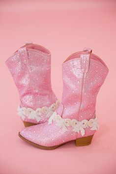 Step out in style with our MINI KIDS BEADED BOW PINK BOOTS! These darling pink sparkle boots feature playful pink beaded bow patches that are sure to add a touch of whimsy to any outfit. Perfect for your little fashionista! This is a made-to-order item. All customized orders are currently shipping within 14 business days. To receive item quicker, expedited shipping is available at checkout. Pink Round Toe Party Boots, Spring Boots With Glitter Accents And Round Toe, Spring Embellished Pink Boots, Embellished Pink Boots For Spring, Pink Embellished Boots For Spring, Spring Pink Embellished Boots, Pink Glitter Boots With Round Toe, Cute Pink Boots With Round Toe, Cute Pink Round Toe Boots