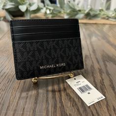 Michael Kors New Leather Card Holder. Style Is Cooper, Black On Black, Has Card Slots On Both Sides And Open Center For Bills Or Additional Cards. New With Tags And In Excellent Condition. I Have Several Colors Available, Check Other Listings For Additional Choices While Available. Michael Kors Card Holder, Black Leather Card Holder With Logo, Classic Black Card Holder With Logo, Black Rectangular Wallet With Logo, Black Rectangular Wallets With Logo, Black Business Wallet With Logo, Michael Kors Black Wallet For Everyday Use, Michael Kors Black Everyday Wallets, Black Leather Wallet For Shopping