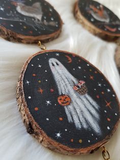 the space shuttle is painted on wood slices with pumpkins and other decorations around it