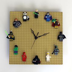 a clock made out of legos on a wall