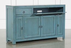 a blue cabinet with two drawers and a drawer on the top is shown in front of a white wall