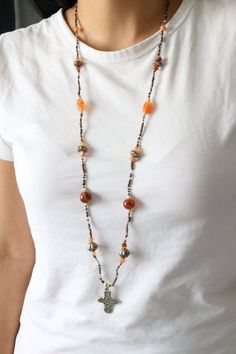 Vintage beaded cross necklace with natural agate stones.Length (Doubled):  18"Pendant length: 1 1/4"Weight: 28.7 gramsGood vintage condition!For more necklaces:https://www.etsy.com/shop/SusVintage?ref=l2-shopheader-name§ion_id=14148238For more jewelry please visit my website:https://www.aiamou.comBack to the shop:https://www.etsy.com/shop/SusVintage?ref=hdr_shop_menuDon't hesitate to contact me if you have any further questions.Thank you for looking!! Beaded Cross Necklace, Beaded Cross, Carnelian Beads, Agate Beads, Agate Stone, Bead Necklace, Necklace Etsy, Cross Necklace, Agate