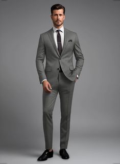 Revamp your style and embrace the confidence that comes with impeccable voguish flair through our Marco Stretch Worsted Gray Wool Suit. Crafted from Superfine 150's Wool, this suit emanates timeless allure with its solid pattern and gray color. What truly distinguishes this suit is its innovative incorporation of stretch, ensuring not only a refined tailored fit but also unparalleled freedom of movement. Whether you're making a grand entrance at a glamorous event, navigating the urban landscape, Grey Suit Men, Dark Gray Suit, Grey Wool Suit, Harris Tweed Jacket, Herringbone Jacket, Preppy Men, Oxford Blue, Tweed Suits, Linen Suit