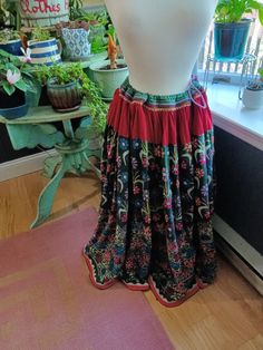 Beautiful, hand-embroidered, hand-made, one-of-a-kind, vintage Indian Banjara skirt.  Dating back to 1960s or 1970s, it's likely that the actual cotton fabric in this skirt was hand-woven and hand-dyed...in addition to all of the hand-stitching of the embroidery.  Tiny mirrors are stitched into the embroidery throughout.  Skirt is heavy and can fit a variety of sizes due to the drawstring waist.  On the dress form, the drawstring is pulled to fit a size medium.  However, it can be let out to fit an XXL.  Colors are vibrant with only a tiny bit of fading on the upper portion of the waist on the inside of the skirt.  Otherwise, in great condition with no rips, tears, marks, etc.  Skirt is floor length. See photos for details and measurements. Please message with any questions. Festive Bohemian Cotton Skirt, Bohemian Festival Skirt With Floral Embroidery, Traditional Cotton Skirt For Festival, Bohemian Embroidered Skirt For Festivals, Traditional Embroidered Skirt For Festivals, Bohemian Multicolor Skirt With Floral Embroidery, Festive Bohemian Embroidered Skirt, Vintage Long Skirt For Festival, Multicolor Bohemian Skirt With Floral Embroidery