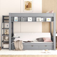 there is a bunk bed with drawers and a mattress on the bottom shelf next to it