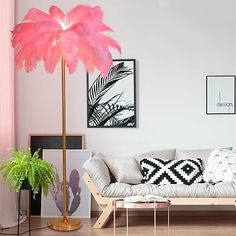 a living room filled with furniture and a pink palm tree