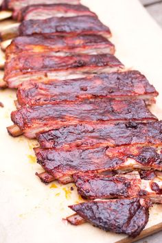 ribs are lined up on a cutting board