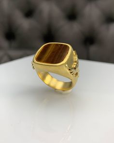 Double Headed Eagle Tiger Eyes Men Ring, Pinky Signet Brown Ring, Square Cut, Genuine Gemstone, Stylish Gold Silver Ring, Handmade Jewelry ◎ Details ◎ ○ Material 14K Solid Gold or 925 Sterling Silver Weight of Ring : approx 19.50 gr Height of Ring : approx 5.30 mm ○ Upgrade to Solid 18K Gold, please click the link below: https://www.etsy.com/listing/962826004 ○ Gemstone Natural Tiger Eyes Gemstone approx. 15 mm x 15 mm 4.00 ct Made to Order HANDMADE ITEM ○ For Men Collection : https://etsy.me/2P Luxury Rings With Natural Stones For Anniversary, Luxury Natural Stones Ring Jewelry, Luxury Jewelry Ring With Natural Stones, Luxury Natural Stone Ring Jewelry, Brown Gemstone Rings In 14k Gold, Luxury Rings With Natural Stones, Luxury Yellow Gold Rings With Natural Stones, Elegant Brown Rings With Natural Stones, Antique Brown Ring Jewelry